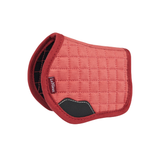 LeMieux AW26 Toy Pony Pad Variant Colour Spiced Earth.
A toy quilted equestrian saddle pad in  spiced earth colour with a contrasting border and a black leather accent, shown on a plain white background. The brand 'LeMieux' is visible on a small red tag.
