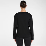 Person wearing a black long-sleeve jumper on a white background