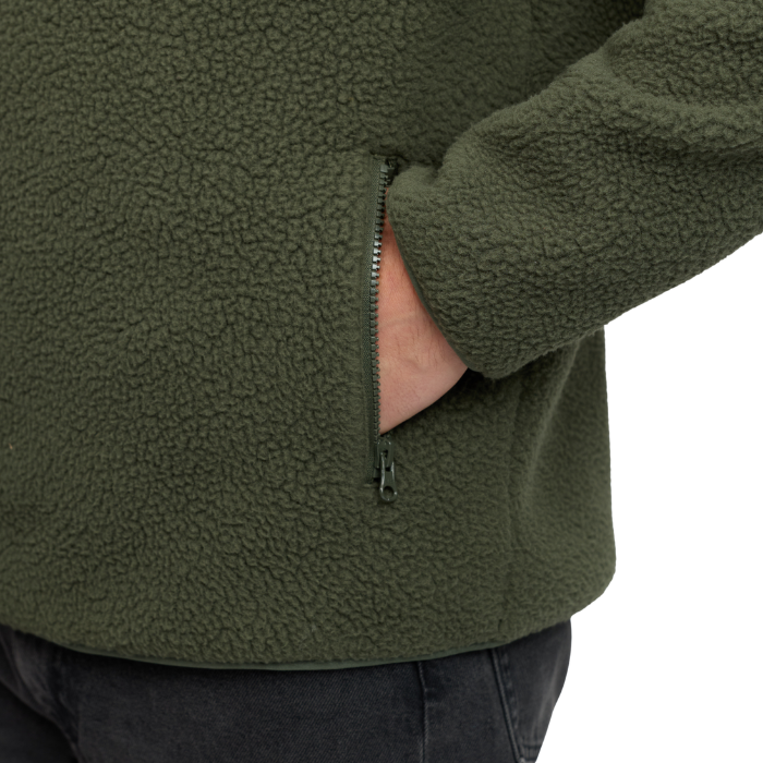 LeMieux AW26 Mens Borg Half Zip Sweat varient Olive. Close up of Olive fleece pocket with green zip. 