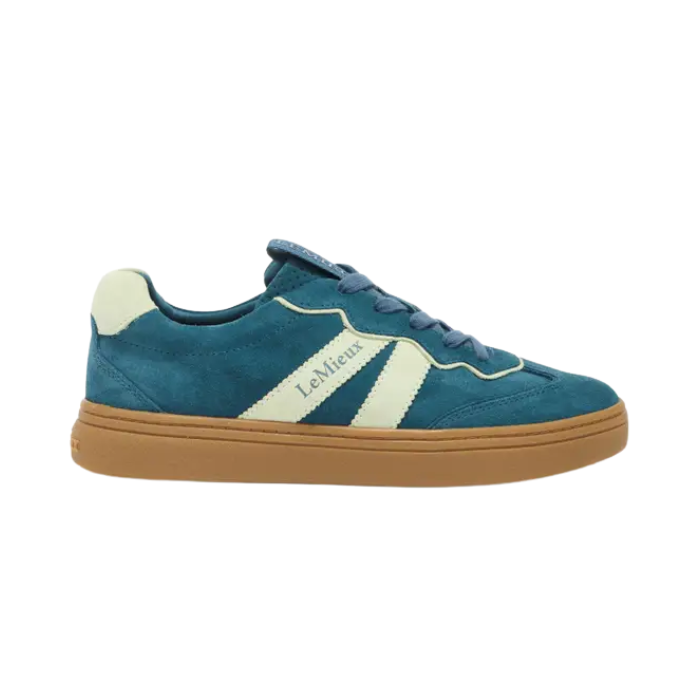 Teal sneaker with brown sole on a white background