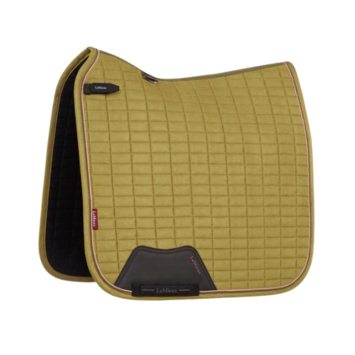LeMieux AW26 Suede Dressage Square Varient Gooseberry. A LeMieux quilted saddle pad in olive green with black leather accents and a black interior lining, shown on a plain white background.