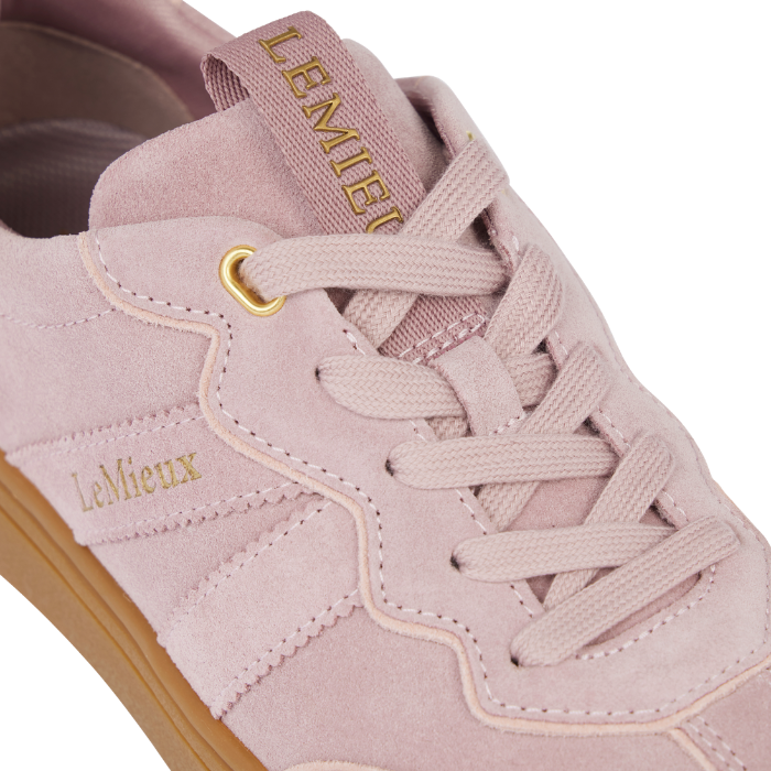 LeMieux AW26 Stockbridge Suede Trainers Variant Colour Wild Rose. A close up of a pink suede shoe with 'LeMieux' brand name is gold colour. on white background.