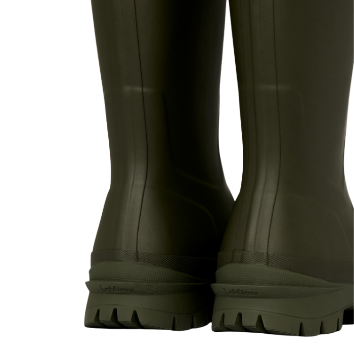 LeMieux AW26 Mens Bramshaw Welly Varient Olive. Close-up rear view of olive green rubber rain boots with textured soles.
