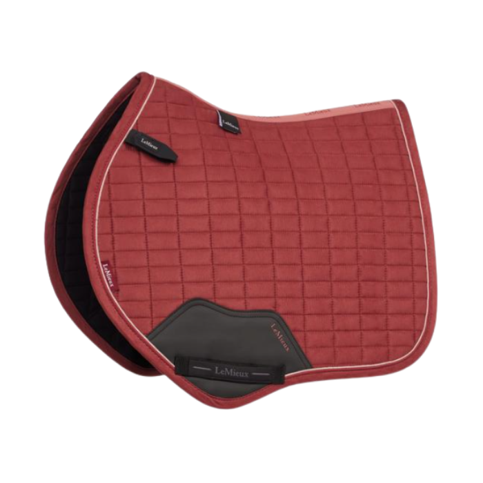 LeMieux AW26 Suede Close Contact Square Varient Russet. A red quilted LeMieux horse saddle pad with black leather accents and white piping, shown on a plain white background.