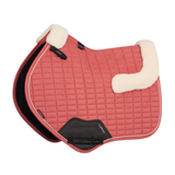 LeMieux AW26 Merino+ Suede Classic Close Contact Square Varient Spiced Earth. A quilted pink equestrian saddle pad with cream sherpa fleece padding on the underside and black leather accents, shown on a plain white background.