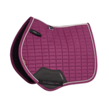 LeMieux AW26 Suede Close Contact Square Varient Blackberry. A magenta quilted equestrian saddle pad with black leather accents and white piping, shown on a plain white background.