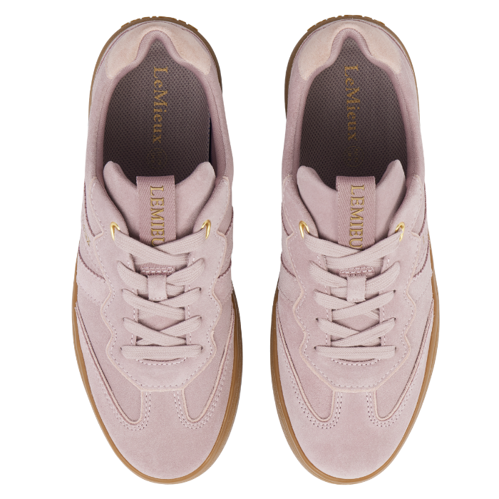 LeMieux AW26 Stockbridge Suede Trainers Variant Colour Wild Rose.
A pair of light pink suede sneakers with gum soles and gold branding details, shown against a plain white background.
