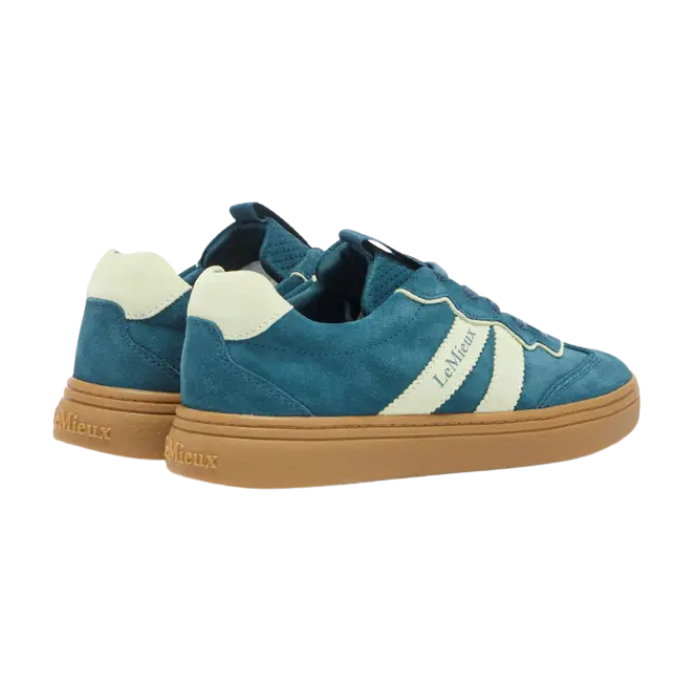 Teal sneakers with white accents and brown soles on a white background