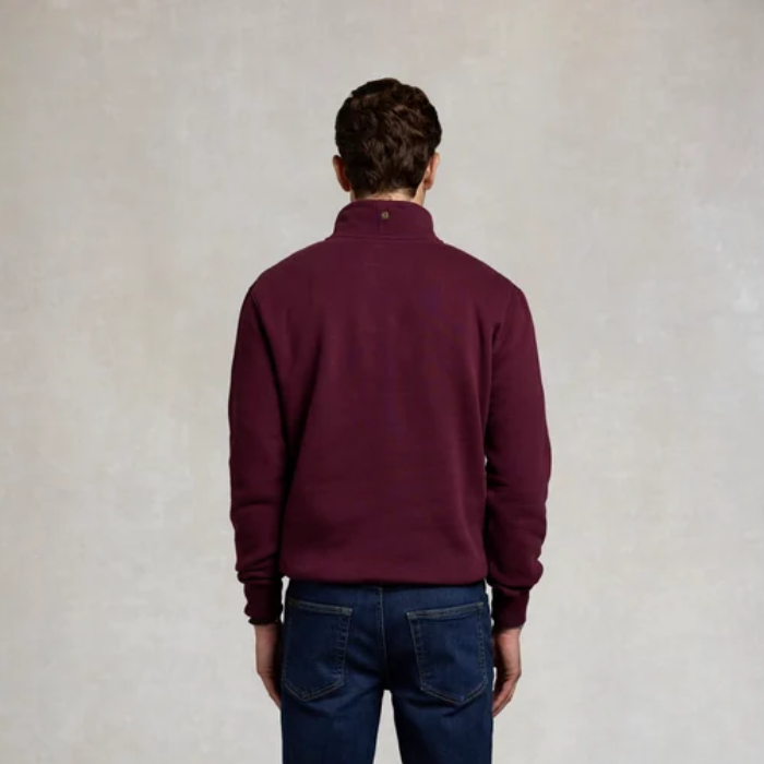 Holland Cooper Heritage Quarter Zip Sweat (Men's) Variant Mulberry. Back of man wearing a Mulberry jumper with a small logo on the collar. 