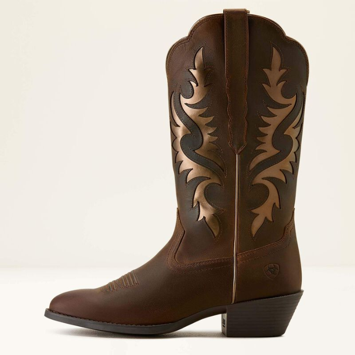 Ariat Ladies Heritage R Toe Western Boot Variant Colour Sassy Brown. Western boot with decorative stitching and gold coloured material with R shaped toe on light cream background. 