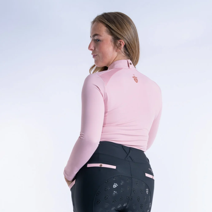 Blackfort Cool Mesh Baselayer AW26-Longsleeve Variant Blush Pink. Back of Pink baselayer with rose gold detailing agaisnt a grey background. 
