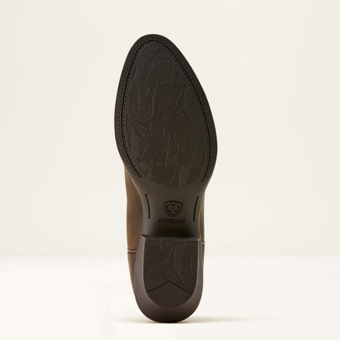 Ariat Ladies Heritage R Toe Western Boot Variant Colour Sassy Brown. The sole of a Western boot with decorative stitching and gold coloured material with R shaped toe on light cream background. 
