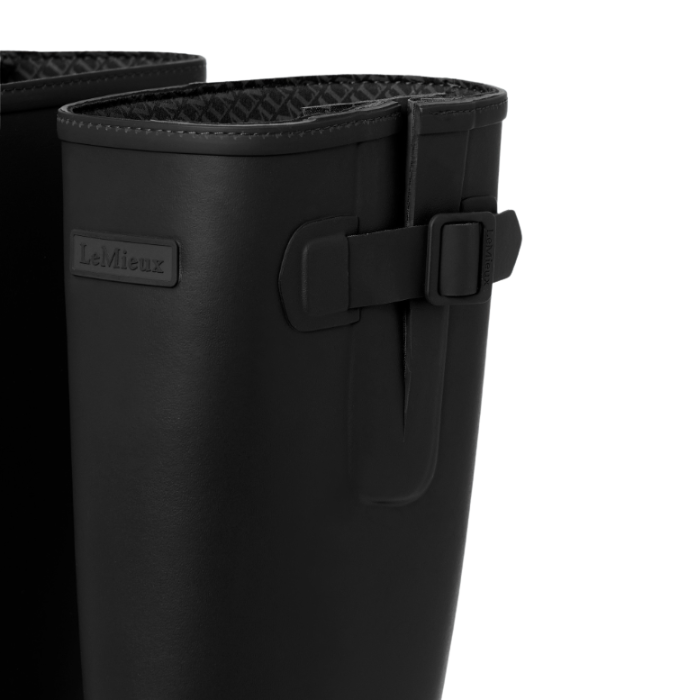 LeMieux AW26 Mens Bramshaw Welly Varient Black. Close-up of a black LeMieux rain boot showing the side strap closure and embossed brand logo on a white background.