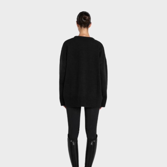 Back of erson wearing a black sweater and trousers on a white background