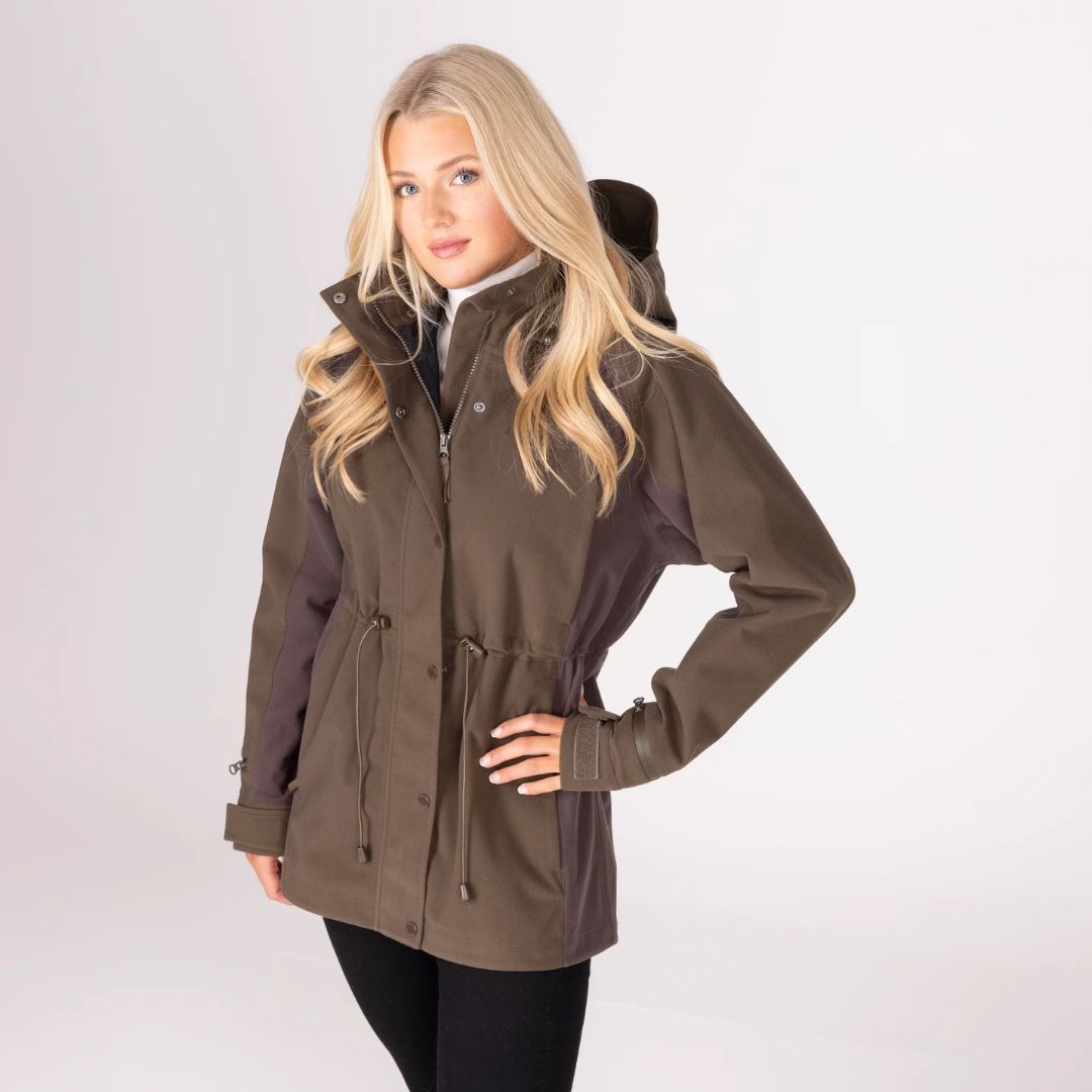 Woman wearing a brown jacket on a white background