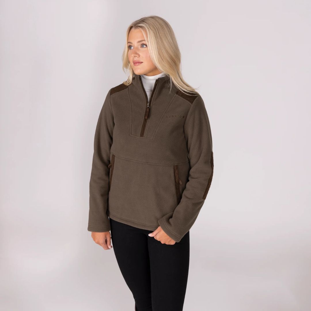 Woman wearing a brown pullover with a white background