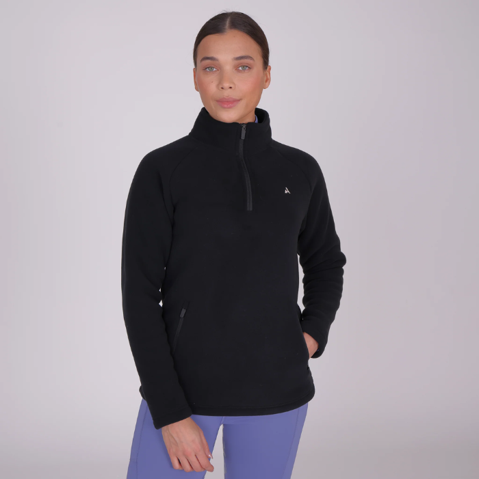 Woman wearing a black fleece pullover with a small logo on a light grey background