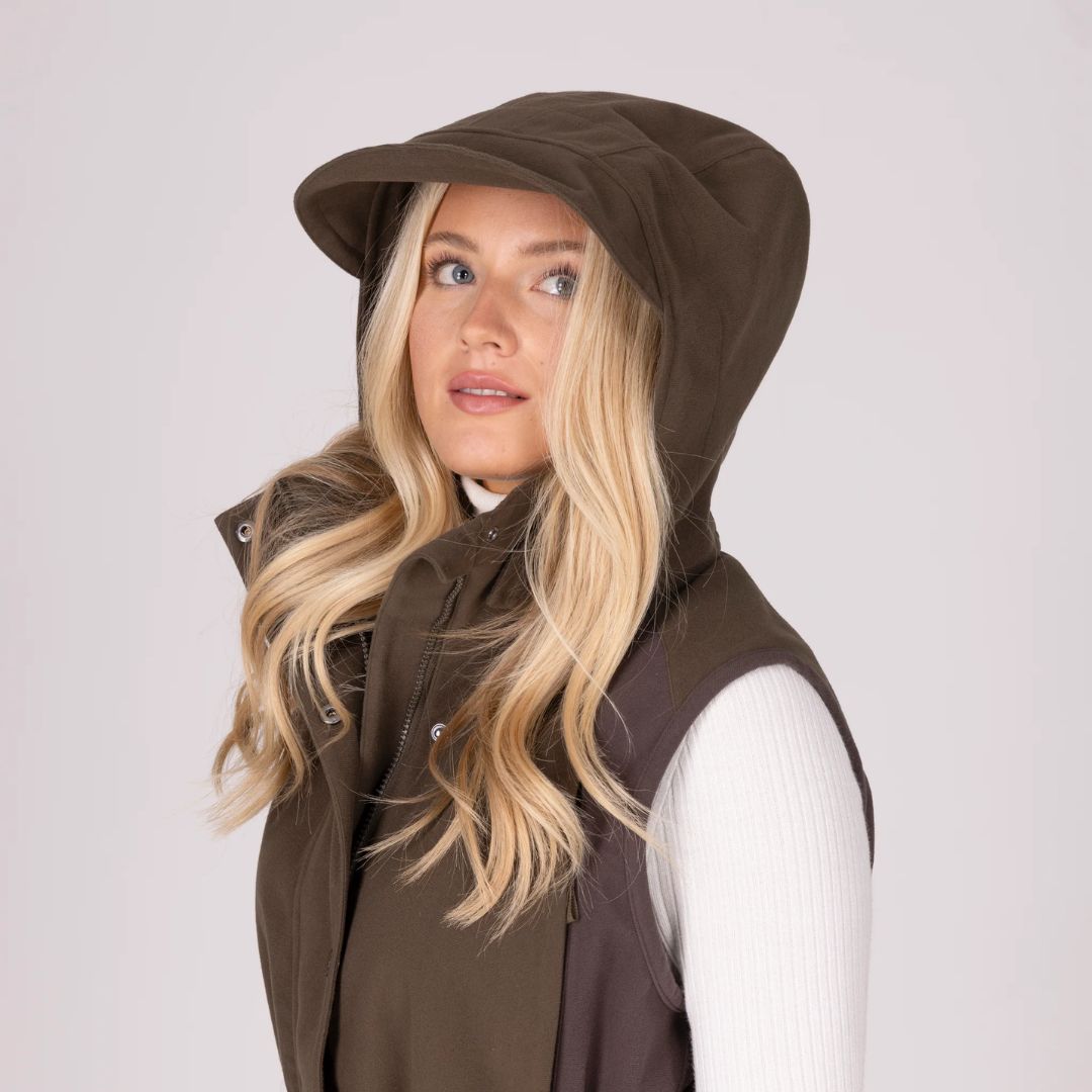 Woman wearing a brown hooded jacket on a white background