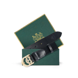 Holland Cooper Stirrup Heritage Belt Variant Colour Black Crystal. A black belt with CH gold buckle in a green box on white background. 