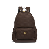 Holland Cooper Burghley Backpack Variant Colour Walnut.
A dark brown backpack with a subtle repeating monogram pattern, featuring a front zippered pocket with a shield-shaped patch and gold-tone hardware, shown on a plain white background.