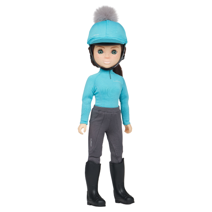 LeMieux Toy Rider Variant Florence. 
A doll with brown hair wearing a light blue riding helmet with a grey pom-pom, a matching light blue long-sleeve top, dark gray riding pants, and black riding boots, set against a plain white background.