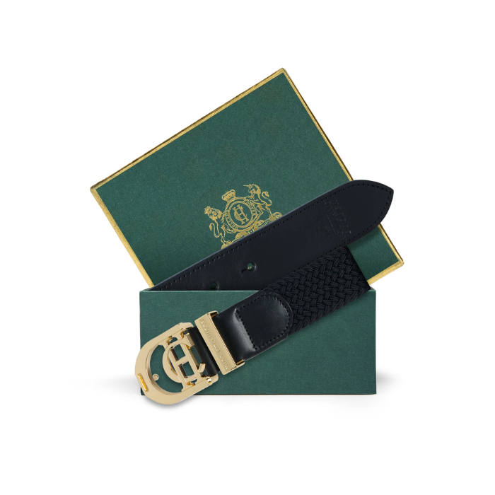 Holland Cooper Stirrup Heritage Belt Variant Colour Black. A black belt with CH gold buckle in a green box on white background. 