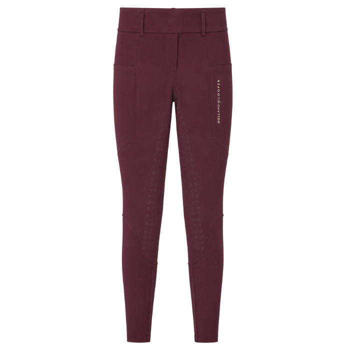 A pair of Holland Cooper women's equestrian riding breeches in a deep burgundy color, featuring a high waist, side pockets, and vertical stitched detailing on the thighs, shown against a plain white background.