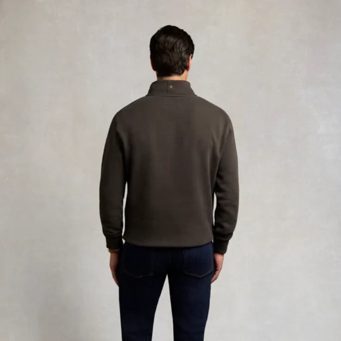 Holland Cooper Classic Quarter Zip Sweat (Men's) Variant Colour Bournville. A male model wearing a grey coloured sweater and blue jeans on grey background.