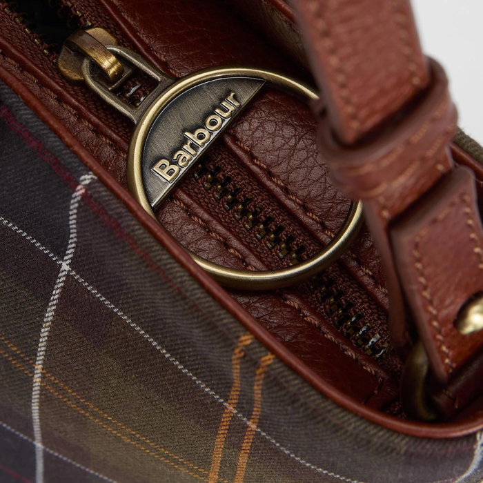 Barbour branded zip pull on a tartan bag