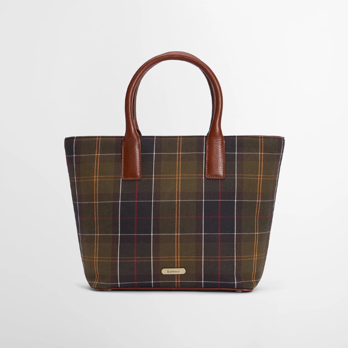 Dark tartan bag with brown leather handles on a white background