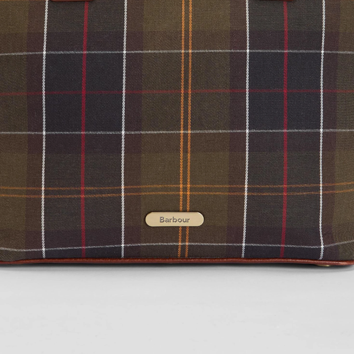 Tartan fabric with Barbour label on a grey background