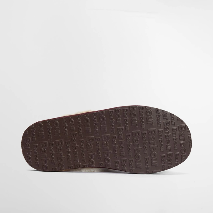 Brown shoe sole with Barbour brand logo on a light grey background