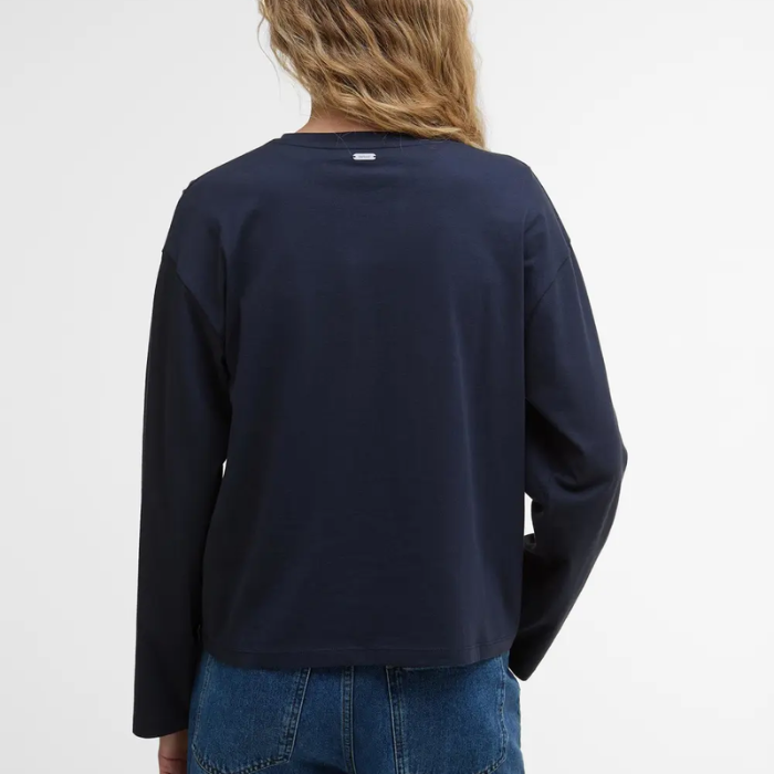 Person wearing a navy long-sleeve t-shirt on a white background with Barbour collar detail