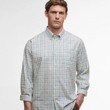 Man wearing a checked shirt on a white background