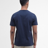 Man wearing a navy blue t-shirt on a white background