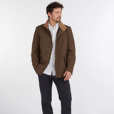 Man Wears Barbour Men's Spoonbill Jacket in Dark Olive