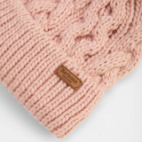 Pink knitted beanie with a Barbour label on a light grey background