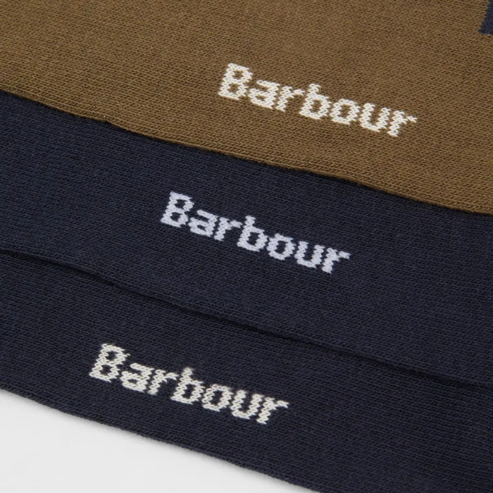 Close-up of Barbour branded socks in brown, navy, and black.