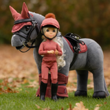 LeMieux AW26 Toy Rider Amelia Varient Multi. Blonde toy rider wearing a spiced outfit and black boots stood by a grey toy horse wearing a matching saddle pad and fly ears.