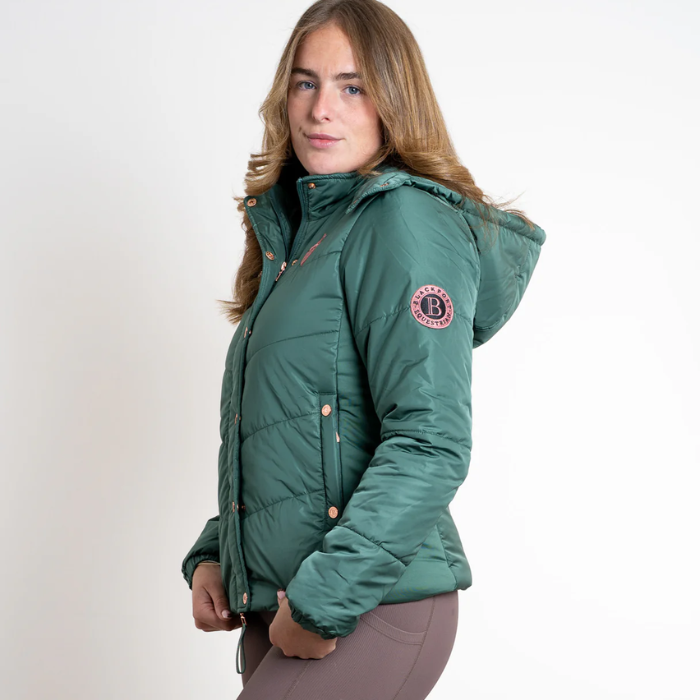 Person wearing a green jacket with a brand logo on a white background