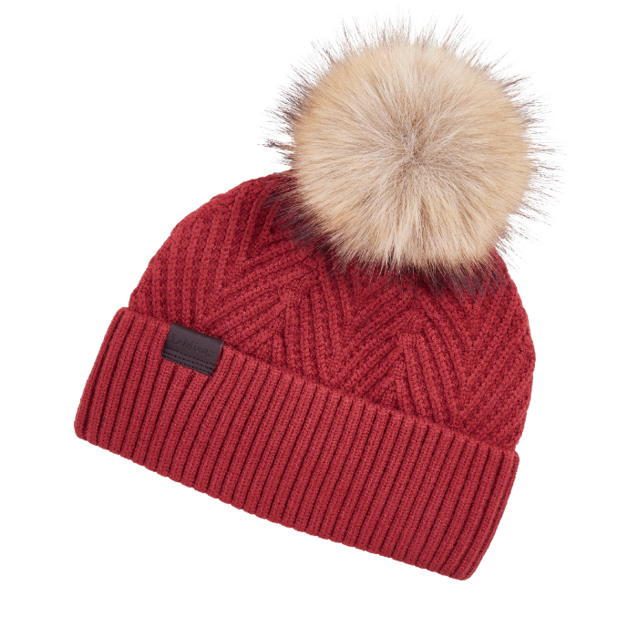 LeMieux AW26 Clara Knit Beanie Russet One Size Variant Colour Russet.
A red cable-knit beanie hat with a ribbed cuff and a large beige faux-fur pom-pom on top, shown against a plain white background.