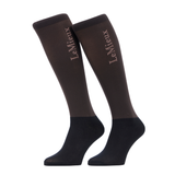 LeMieux AW26 Competition Socks 2 pack Variant Colour Cocoa.
A pair of LeMieux knee-high socks in dark brown and black, featuring the brand name printed vertically in a light pinkish-beige font on the upper leg.