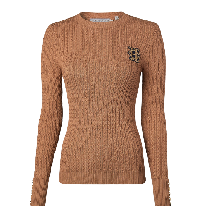 Holland Cooper Princeton Crew Neck Knit Variant Colour Dark Camel.
A camel colour long-sleeve knit sweater with a small gold embroidered logo on the left chest,