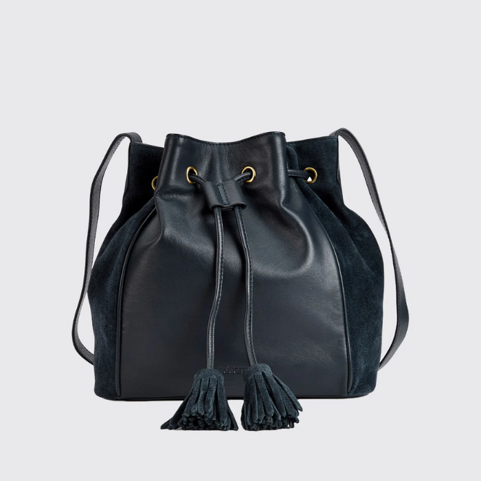 navy pouch style bag with tassel drawstrings on a white background