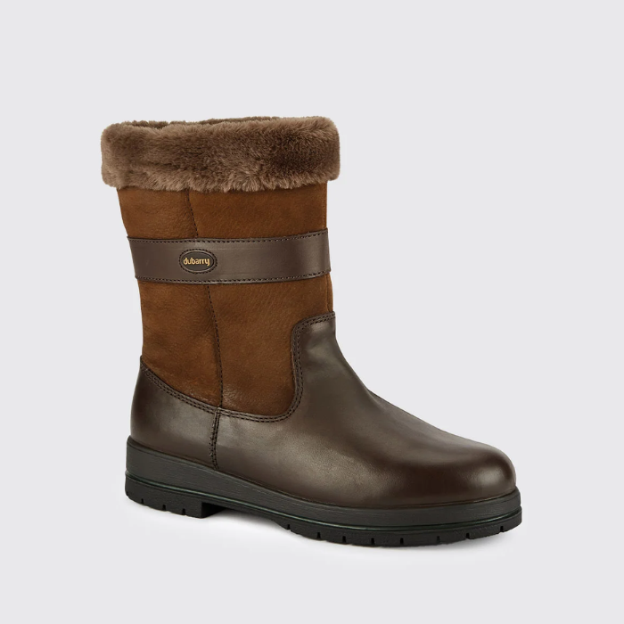 Brown winter boot with fur lining on a light grey background