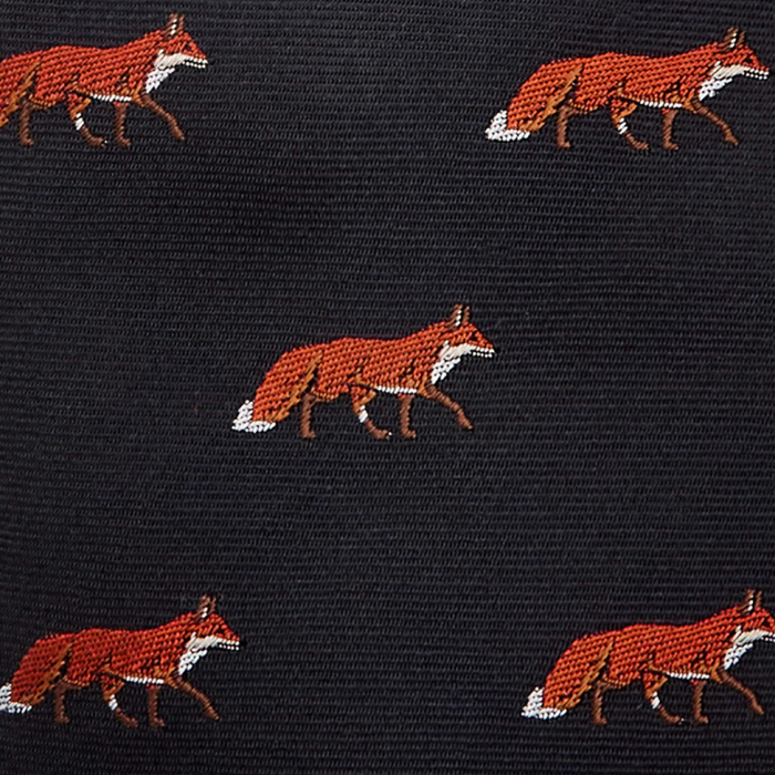 Pattern of red foxes on a navy fabric background