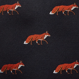 Pattern of red foxes on a navy fabric background