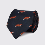 Navy blue tie with red fox pattern on a light grey background