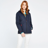 Woman wears the Dubarry Ladies Capeclear Waterproof Jacket in Navy with white jeans