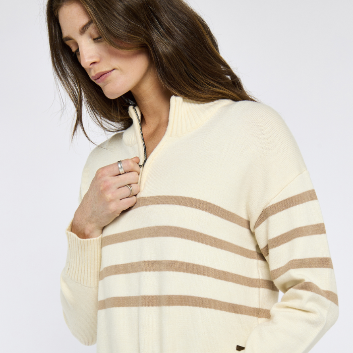 Woman demonstrates zip detail on Dubarry Ladies Fonthill Quarter Zip Sweater in Oyster